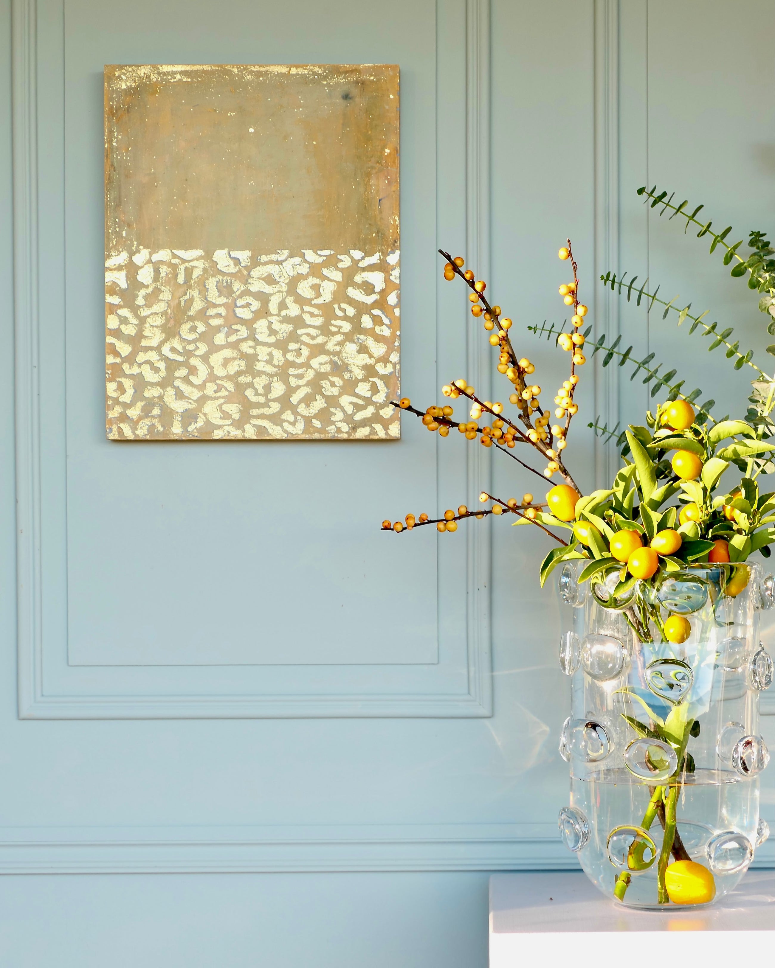 Abstract patina artwork with gold details on wood panel, displayed in interior, Little Treasures series by PATINA & ORO
