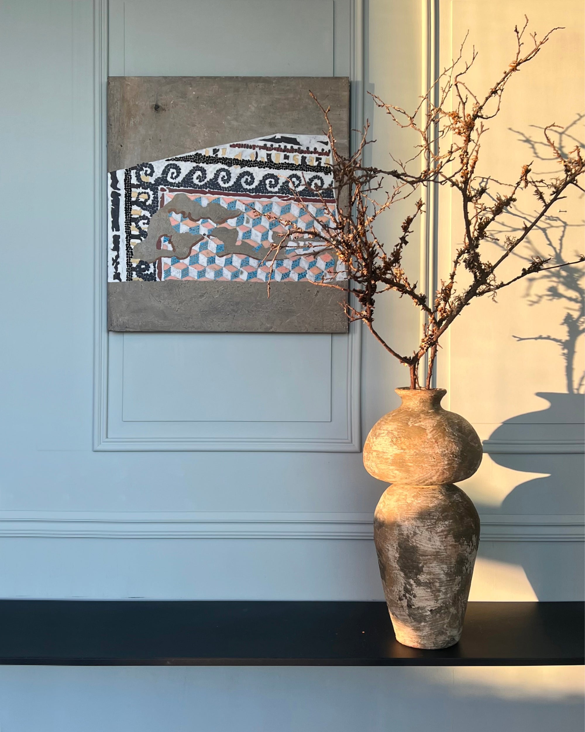 Minimalist interior with contemporary mosaic artwork, abstract wall art inspired by ancient mosaics