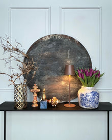 Round abstract artwork displayed in an interior setting, dark patina surface on wood, PURE PATINA – Dark
