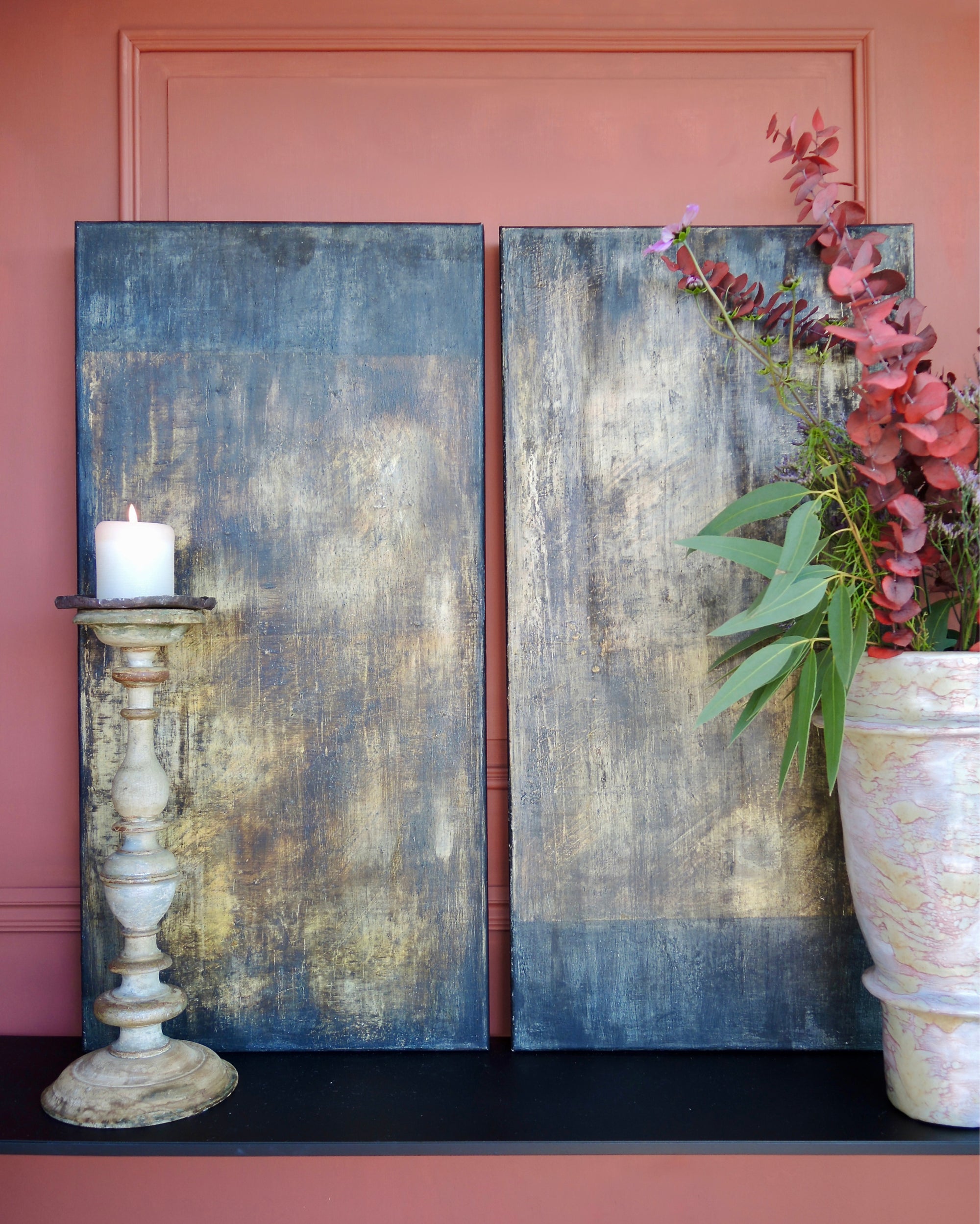 Abstract diptych artwork in an interior setting, showcasing patina textures and natural pigment layers