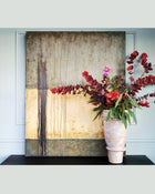 Pure Patina Dark III abstract painting shown in interior setting with natural textures and earthy color transitions
