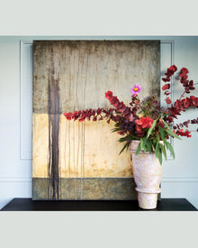 Pure Patina Dark III abstract painting shown in interior setting with natural textures and earthy color transitions
