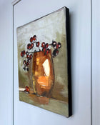 Side view of original still life painting on canvas showing depth and painted edges.