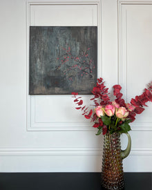 Original still life painting with flowering branch and red blossoms on a dark, textured background, mixed media on canvas, THE COLLECTED by PATINA & ORO.
