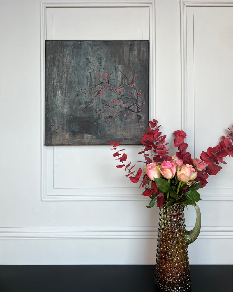 Original still life painting with flowering branch and red blossoms on a dark, textured background, mixed media on canvas, THE COLLECTED by PATINA & ORO.